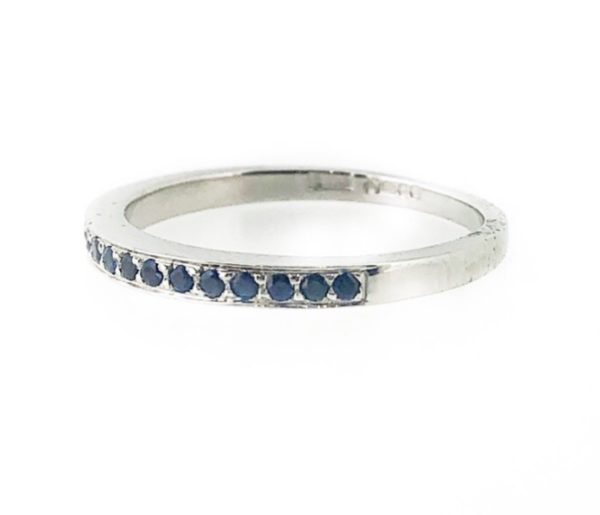 Platinum grain set sapphire eternity ring